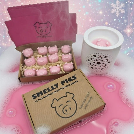 Pink 'Smelly Pigs' scented wax melts with packaging on a decorative background